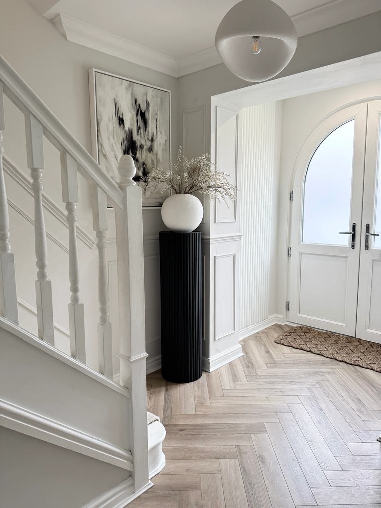 Hallway with hand-painted shaker panelling, spindles and skirting in white